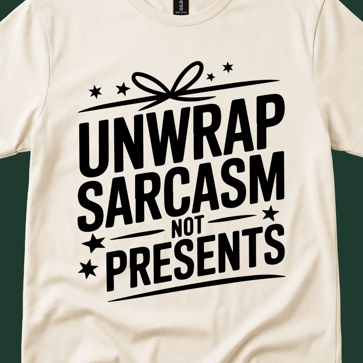 Unwrap Sarcasm Not Presents typography design with gift bow and stars.