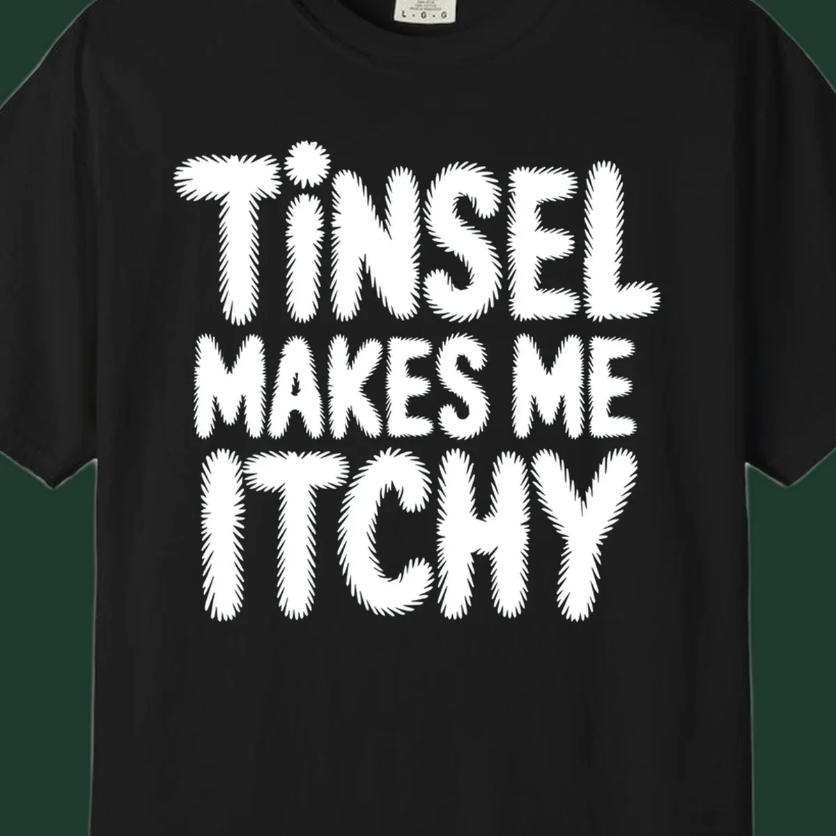 Tinsel Makes Me Itchy typography design in white on black, and black on white.