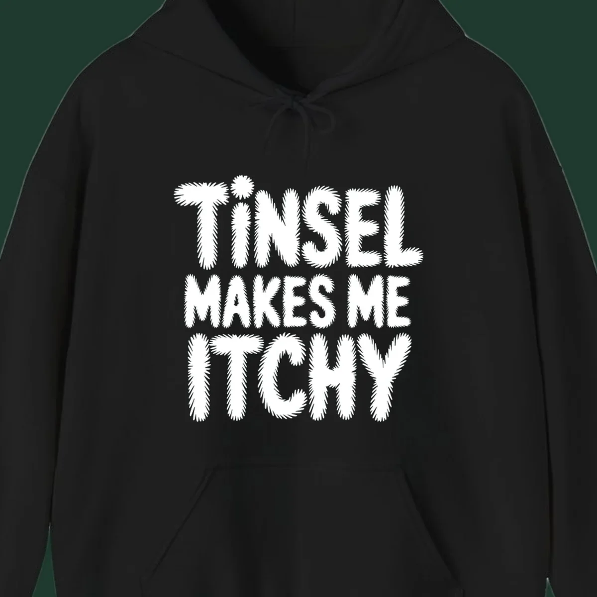 Tinsel Makes Me Itchy typography design in white on black, and black on white.