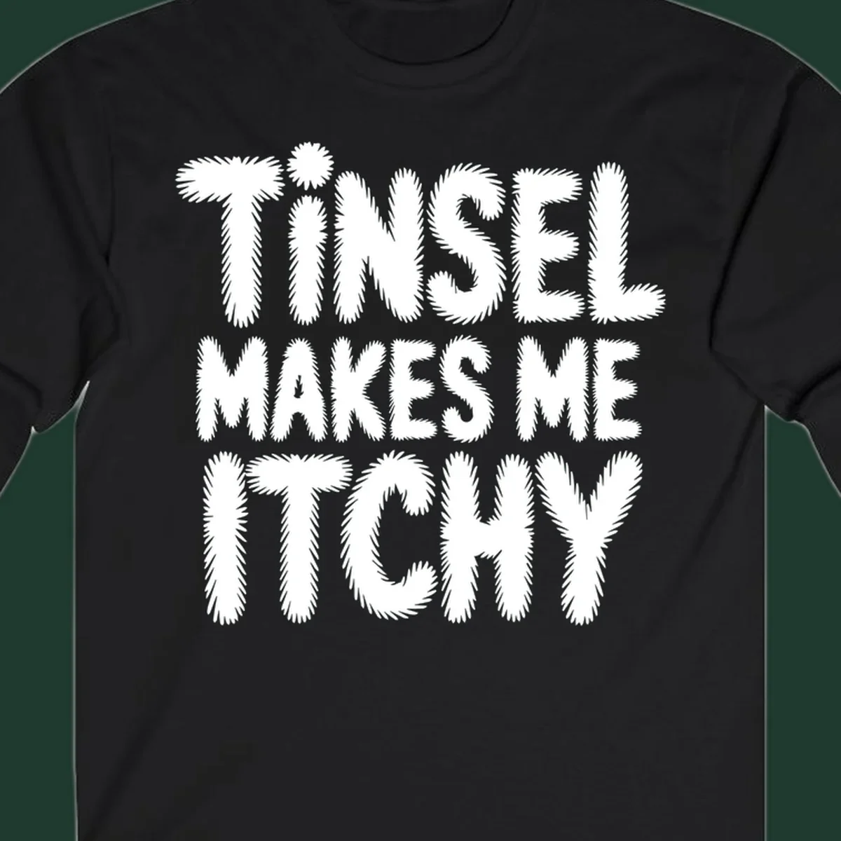 Tinsel Makes Me Itchy typography design in white on black, and black on white.