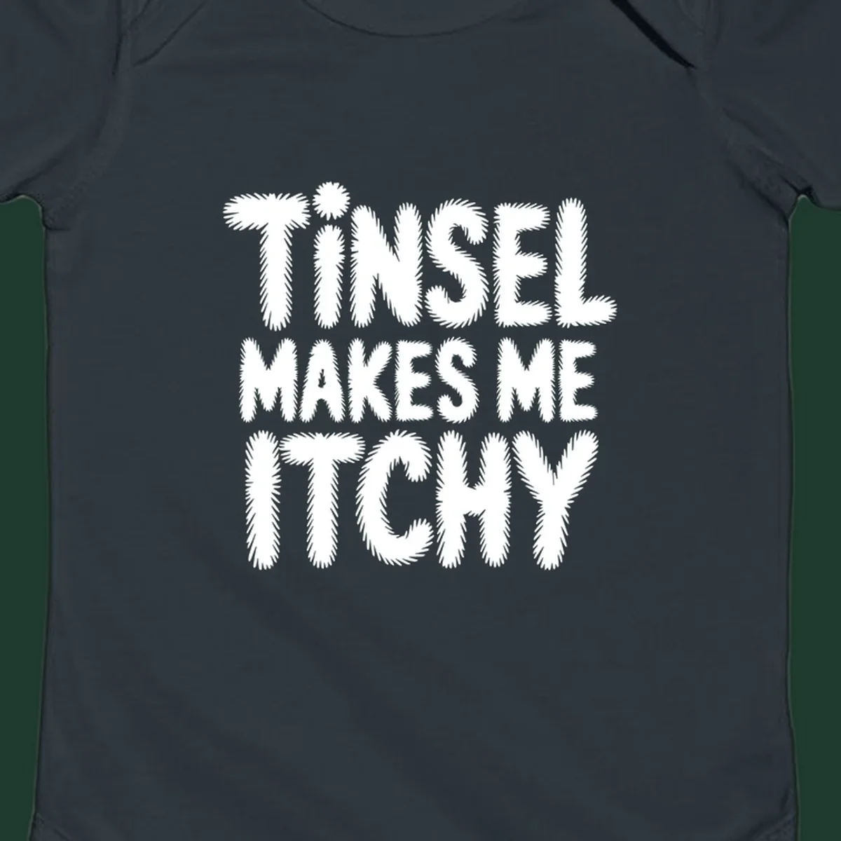 Tinsel Makes Me Itchy typography design in white on black, and black on white.