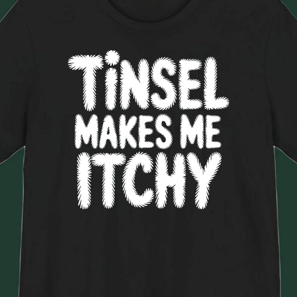 Tinsel Makes Me Itchy typography design in white on black, and black on white.
