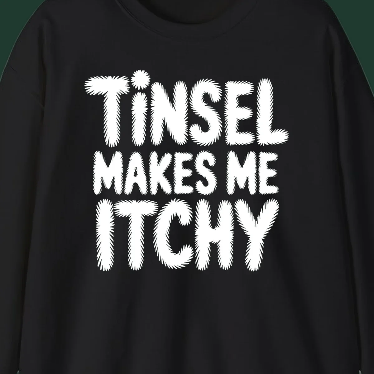 Tinsel Makes Me Itchy typography design in white on black, and black on white.