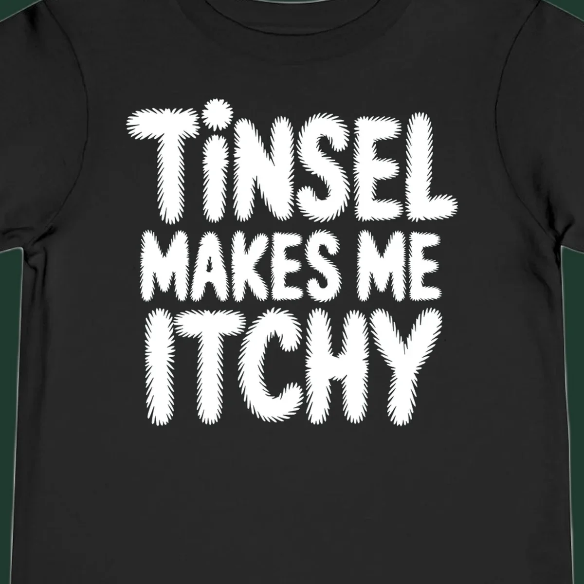 Tinsel Makes Me Itchy typography design in white on black, and black on white.