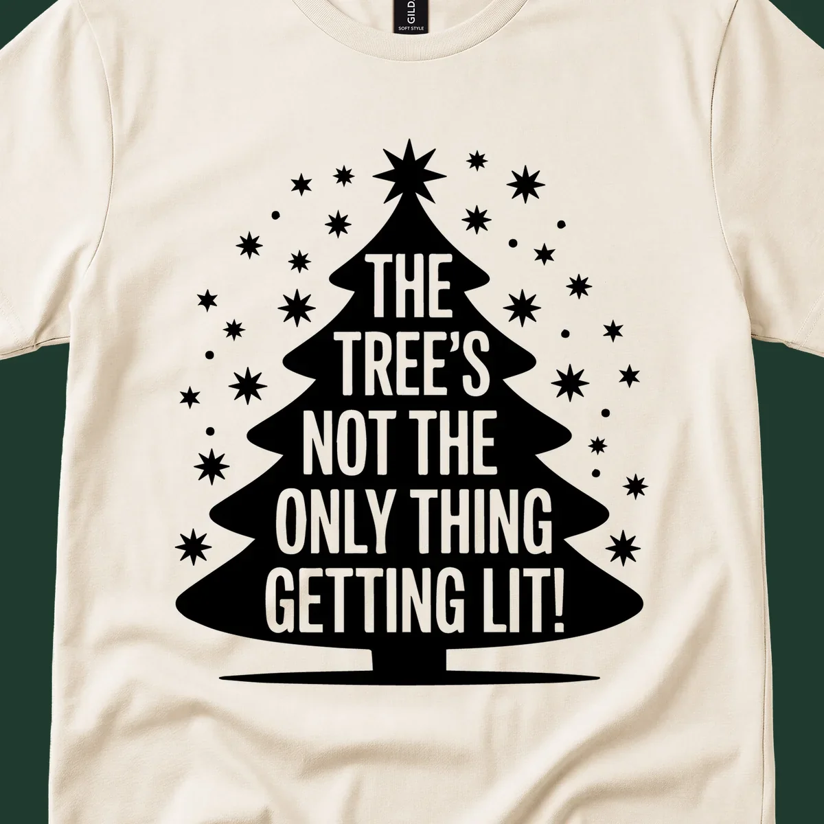 Christmas tree silhouette with text "THE TREE'S NOT THE ONLY THING GETTING LIT!" and surrounding stars.