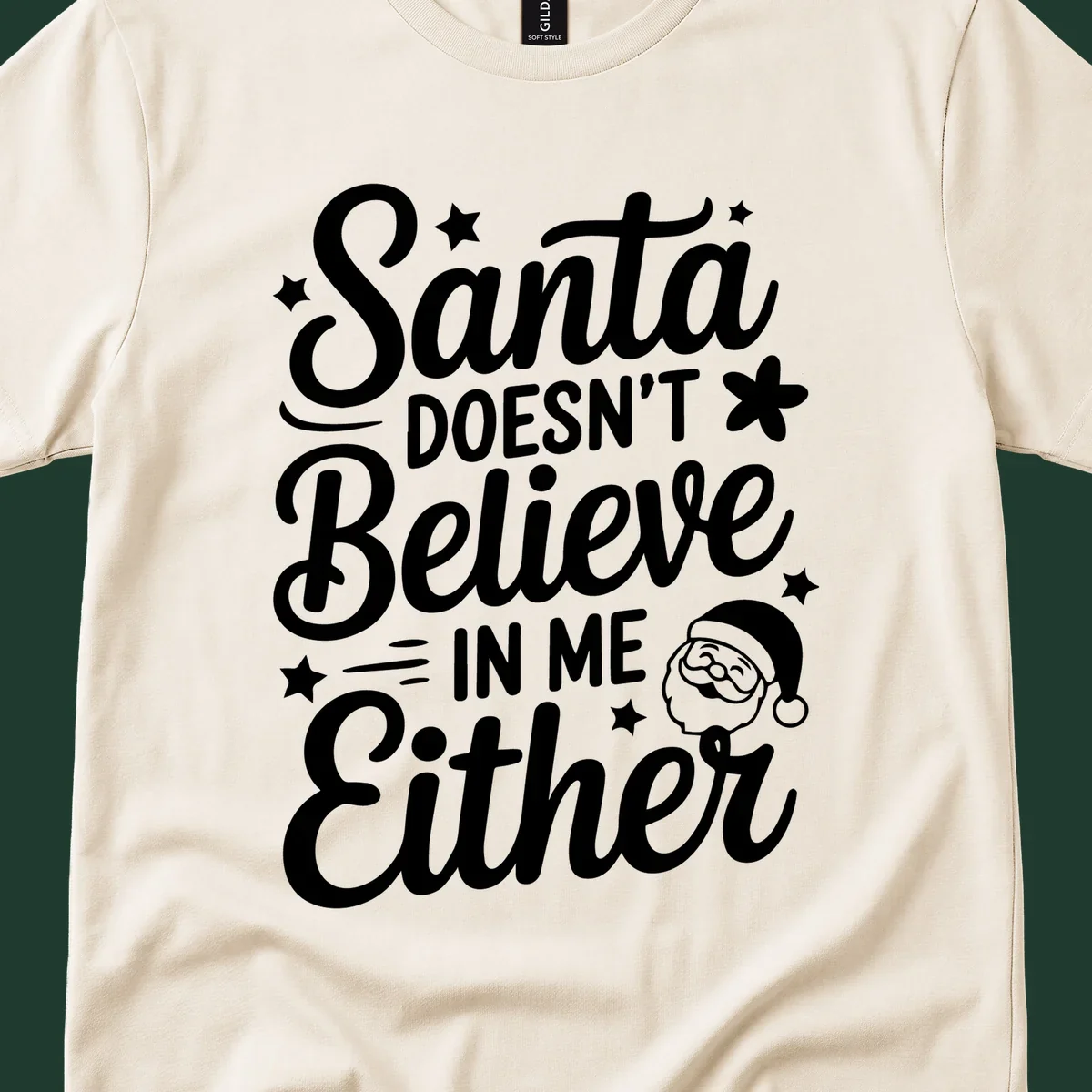 Santa doesn't believe in me either text with Santa illustration and stars.