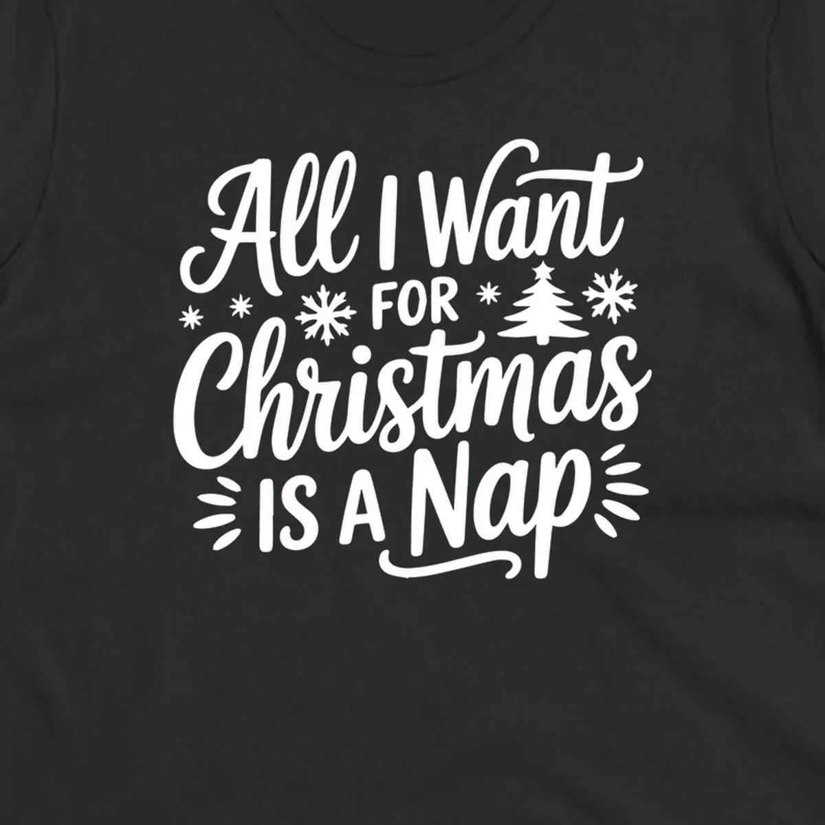 All I Want For Christmas Is A Nap typographic design with snowflakes and a Christmas tree.