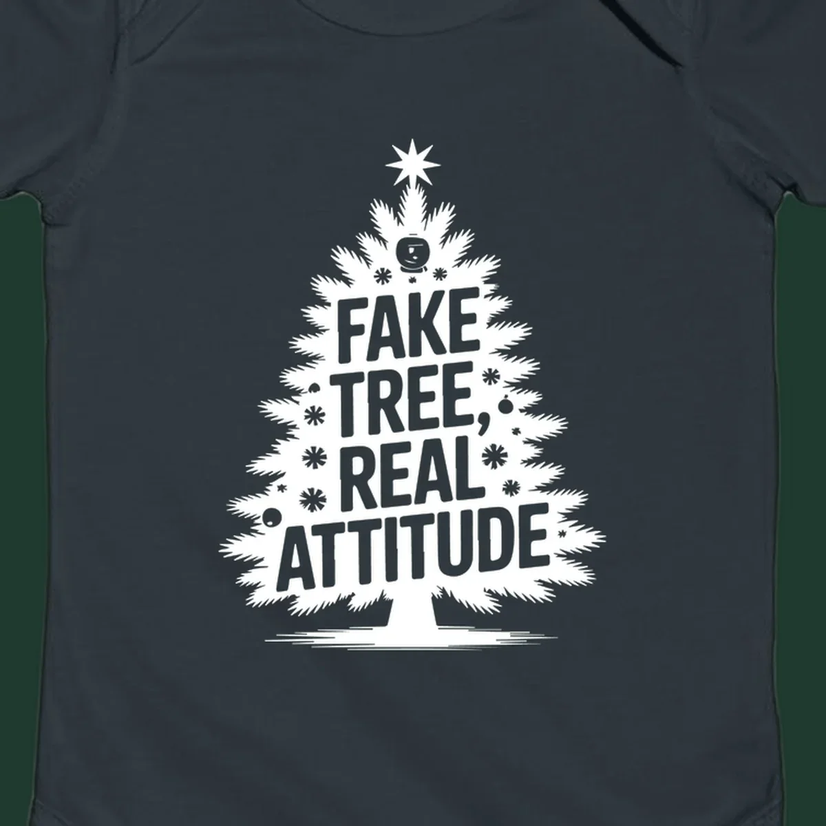 Fake tree, real attitude Christmas graphic with a stylized tree and bold text.