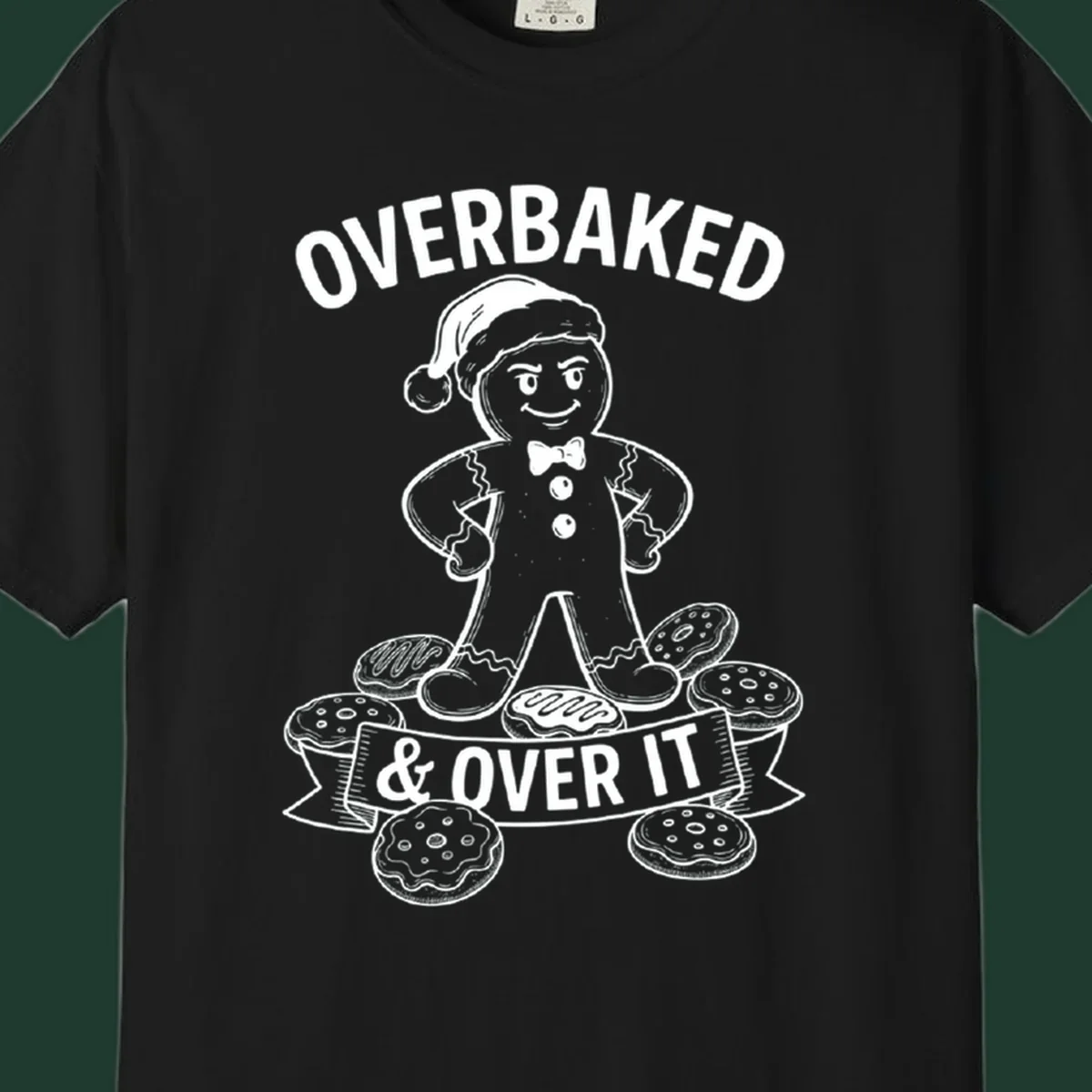 Overbaked gingerbread man with Santa hat and cookies, text says OVERBAKED & OVER IT.