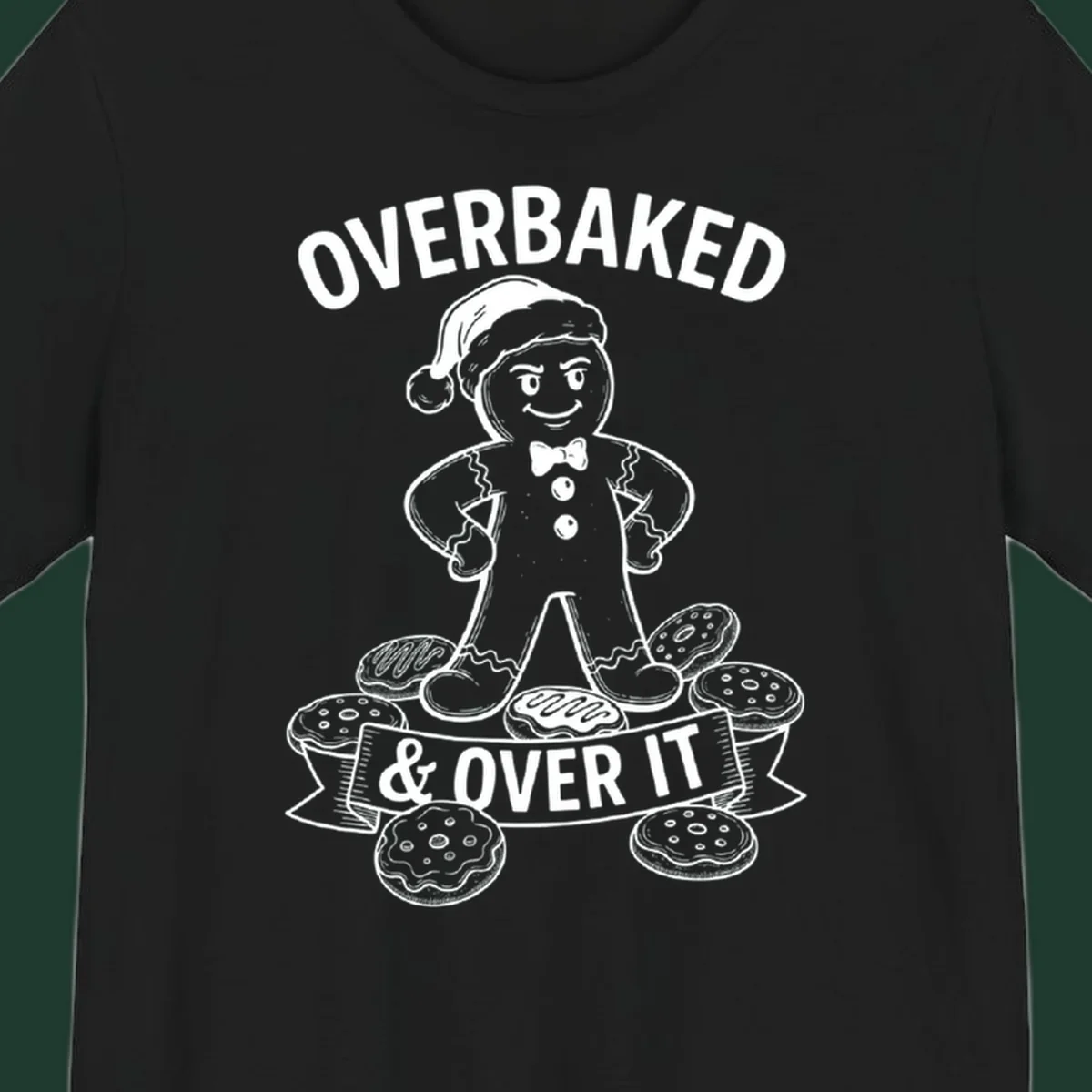 Overbaked gingerbread man with Santa hat and cookies, text says OVERBAKED & OVER IT.
