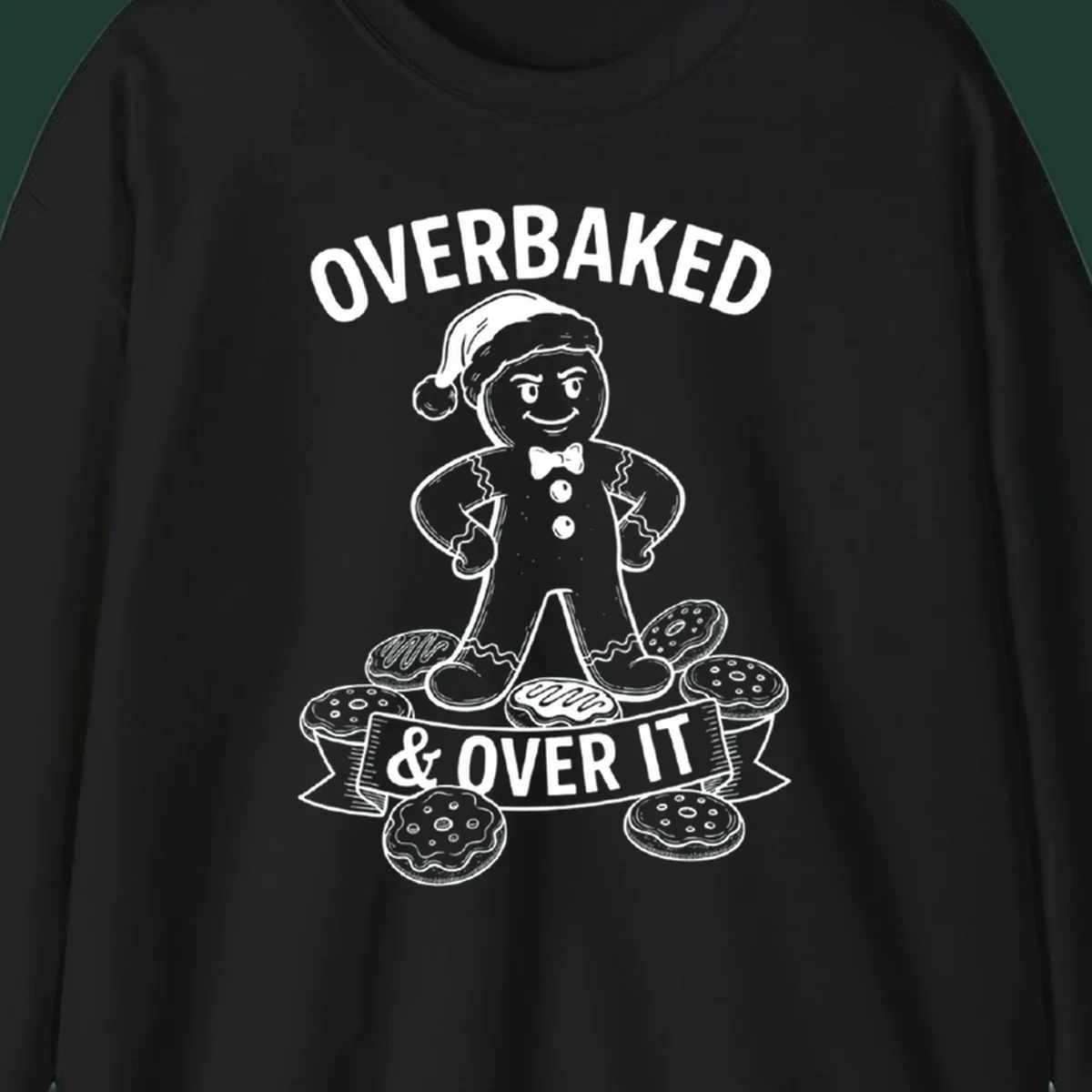 Overbaked gingerbread man with Santa hat and cookies, text says OVERBAKED & OVER IT.