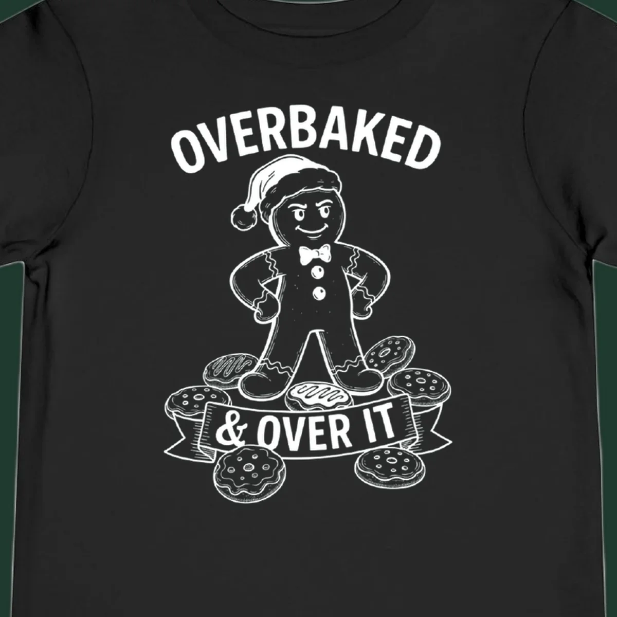 Overbaked gingerbread man with Santa hat and cookies, text says OVERBAKED & OVER IT.