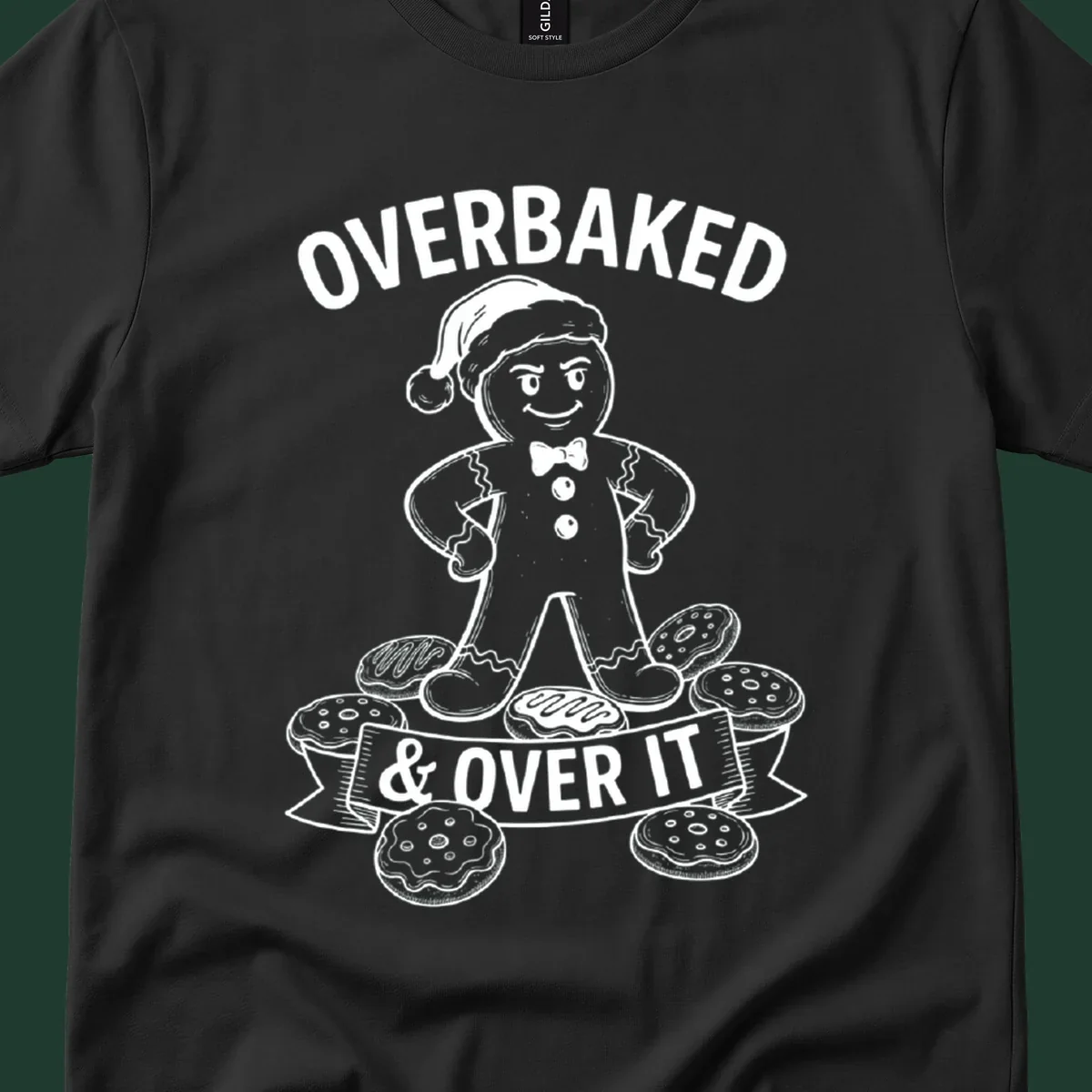 Overbaked gingerbread man with Santa hat and cookies, text says OVERBAKED & OVER IT.