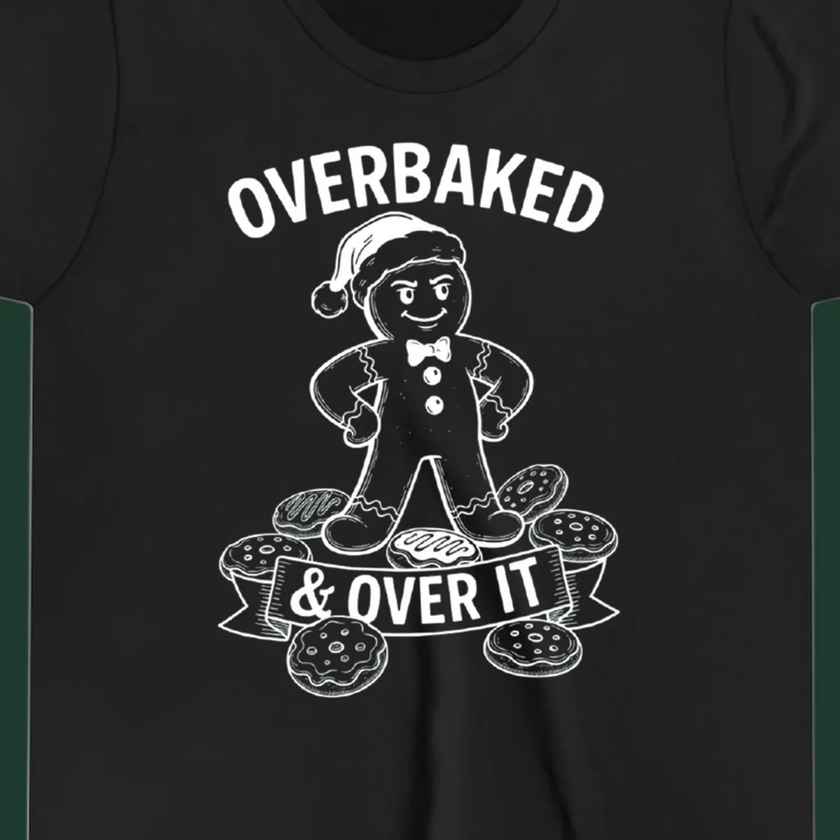 Overbaked gingerbread man with Santa hat and cookies, text says OVERBAKED & OVER IT.