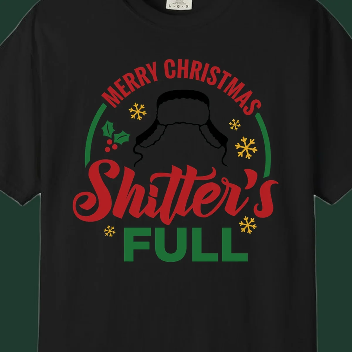 Christmas Shitter's Full graphic with text, hat silhouette, holly, and snowflakes.