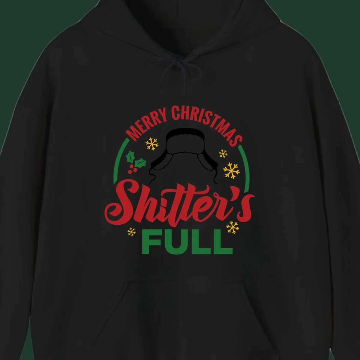 Christmas Shitter's Full graphic with text, hat silhouette, holly, and snowflakes.