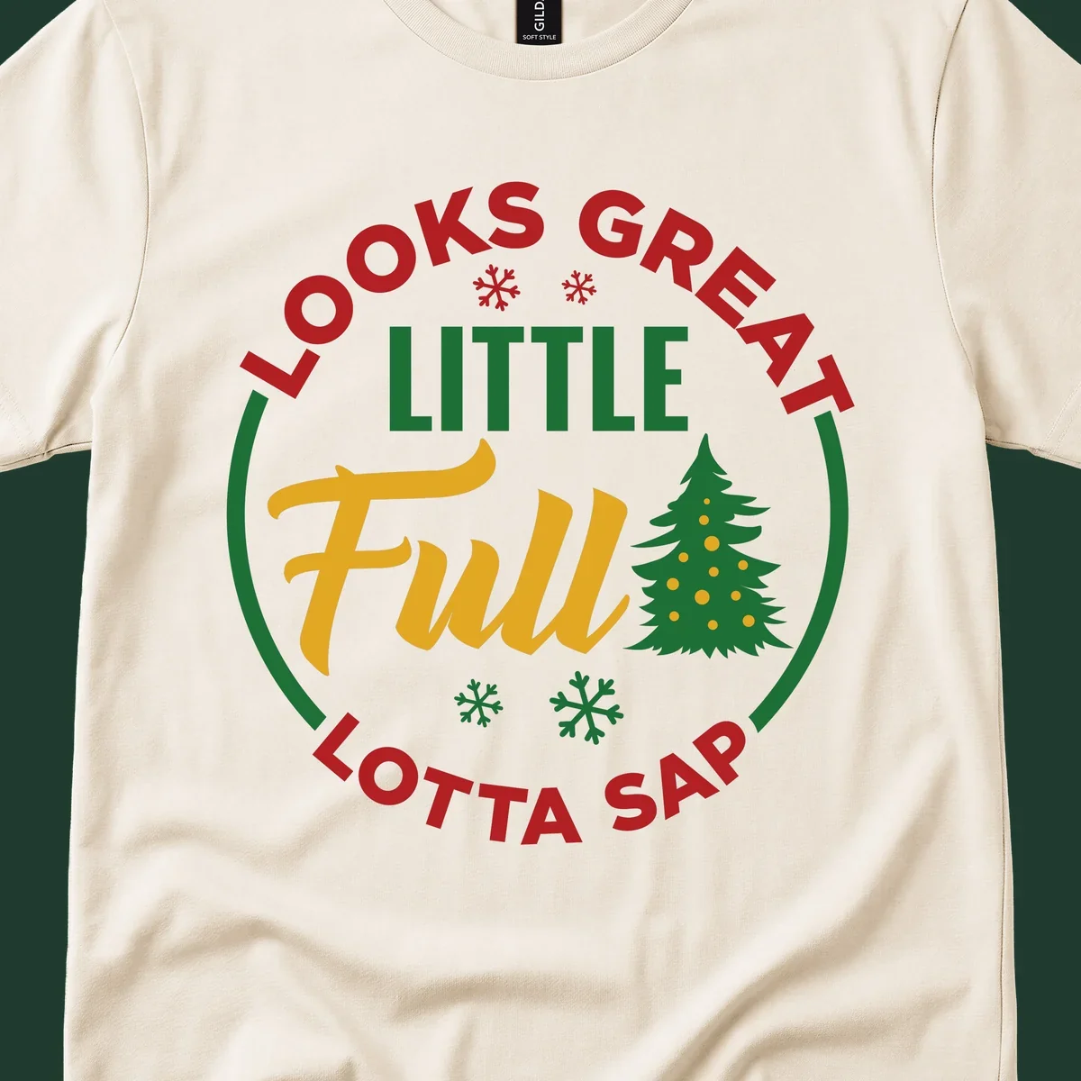 Circular text reads "Looks Great Little Full Lotta Sap" with a Christmas tree and snowflakes.