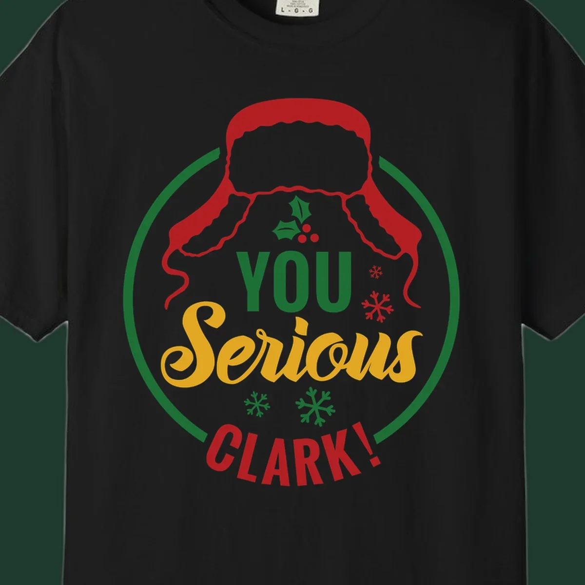 Christmas Clark quote graphic with a hat, holly, and snowflakes.