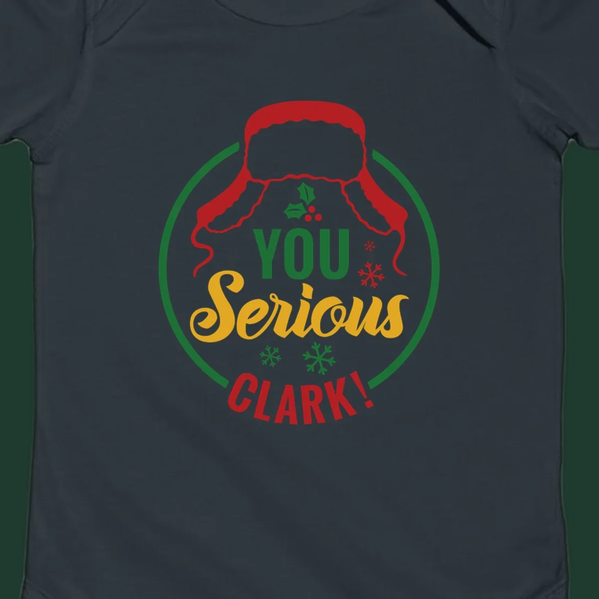 Christmas Clark quote graphic with a hat, holly, and snowflakes.