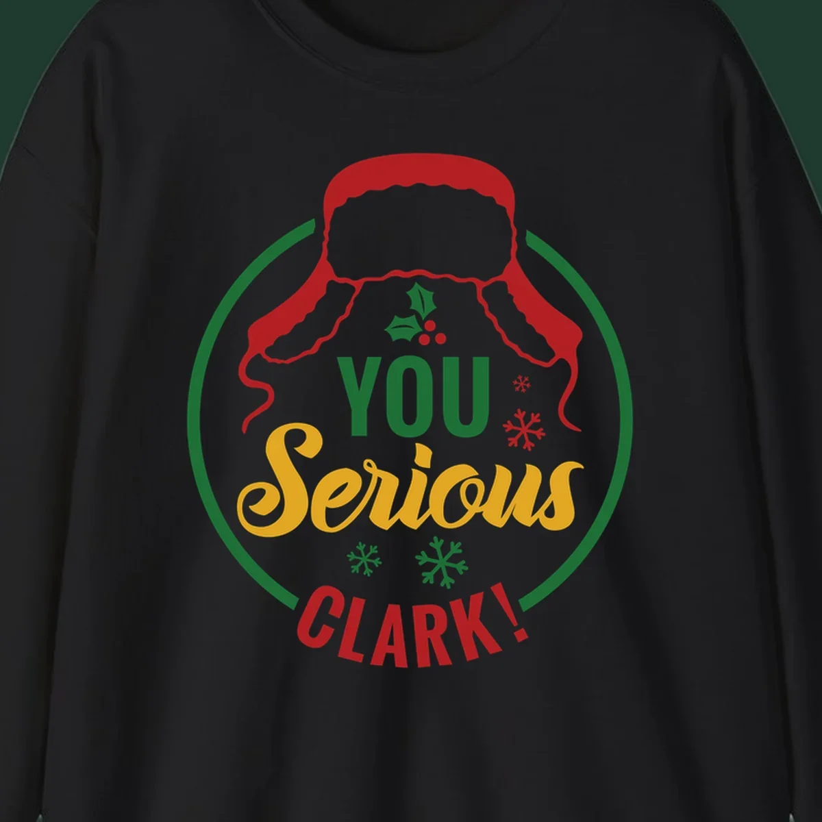 Christmas Clark quote graphic with a hat, holly, and snowflakes.