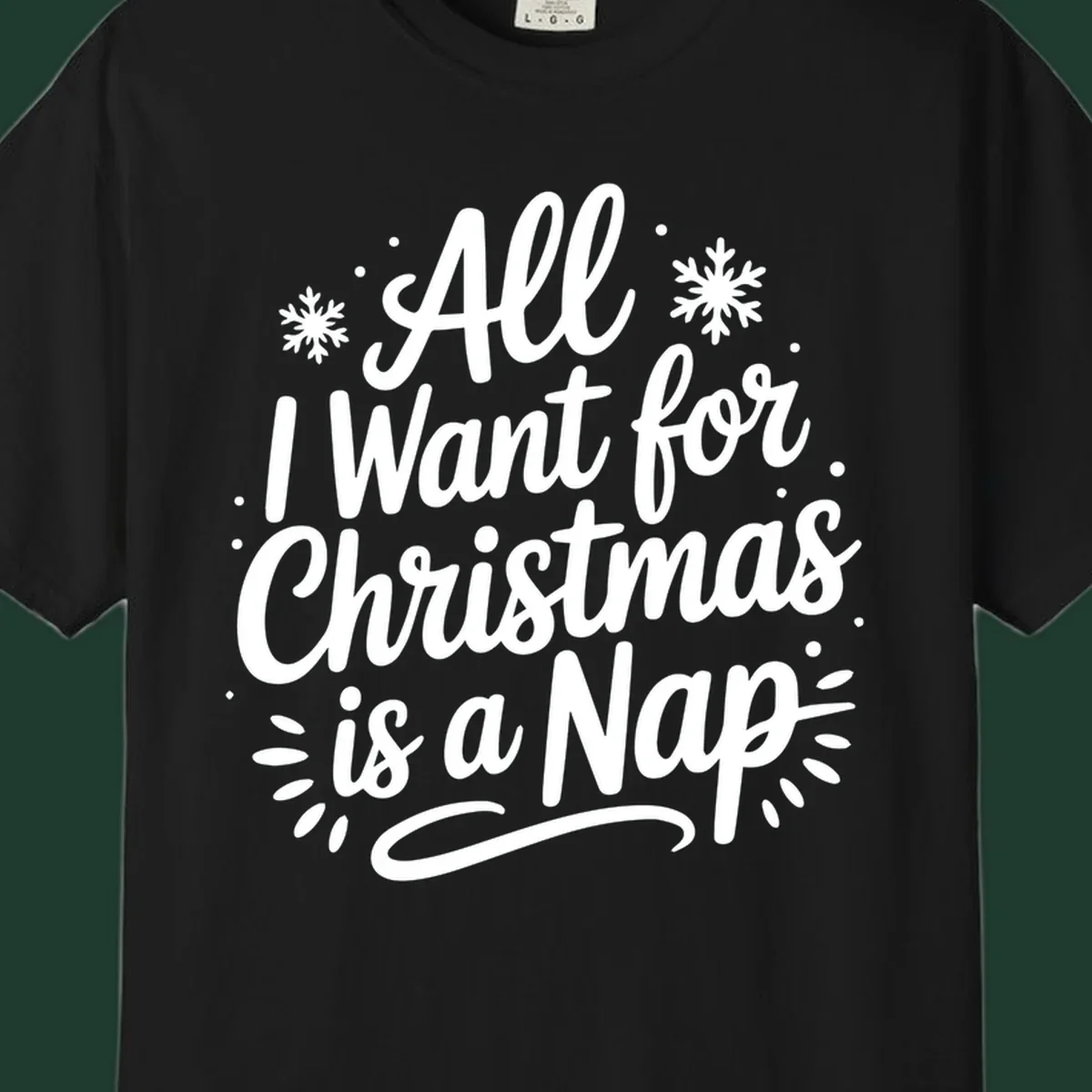 All I Want for Christmas Is A Nap typography design with snowflakes.