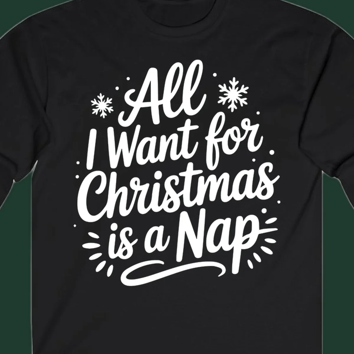 All I Want for Christmas Is A Nap typography design with snowflakes.