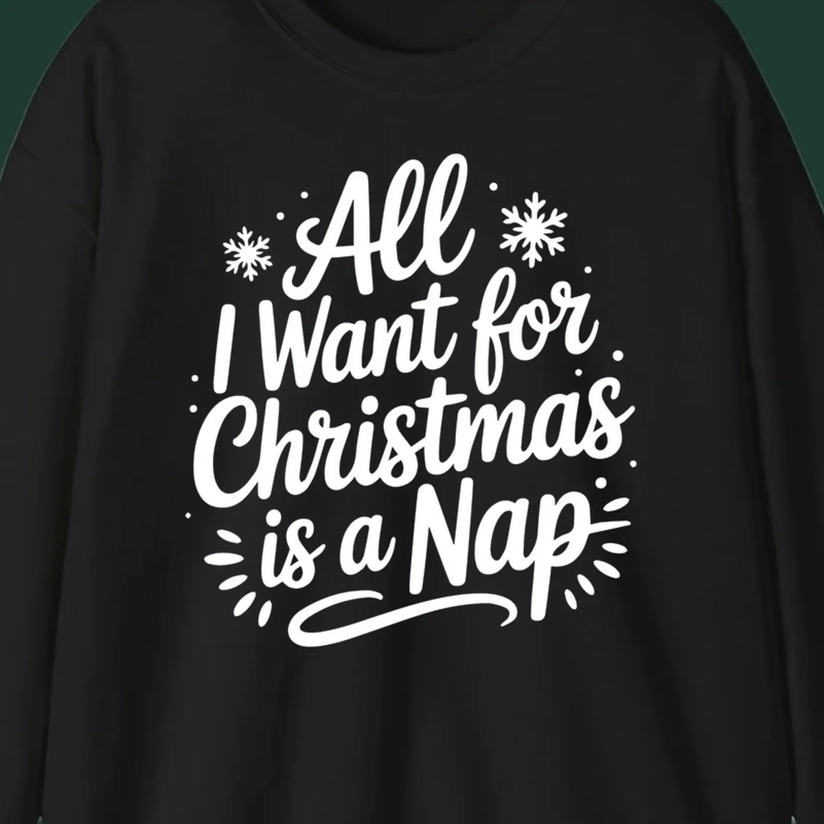 All I Want for Christmas Is A Nap typography design with snowflakes.