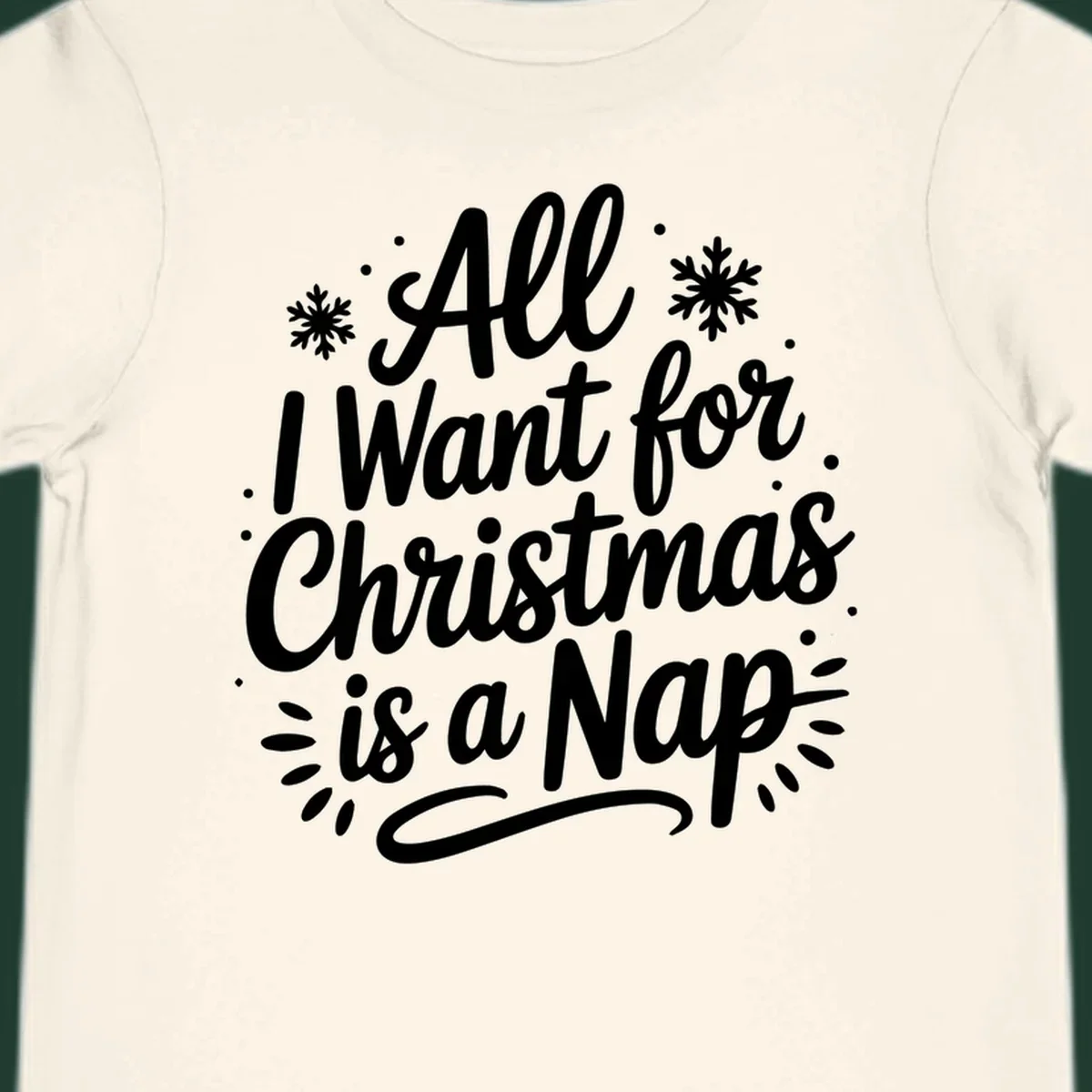 All I Want for Christmas Is A Nap typography design with snowflakes.