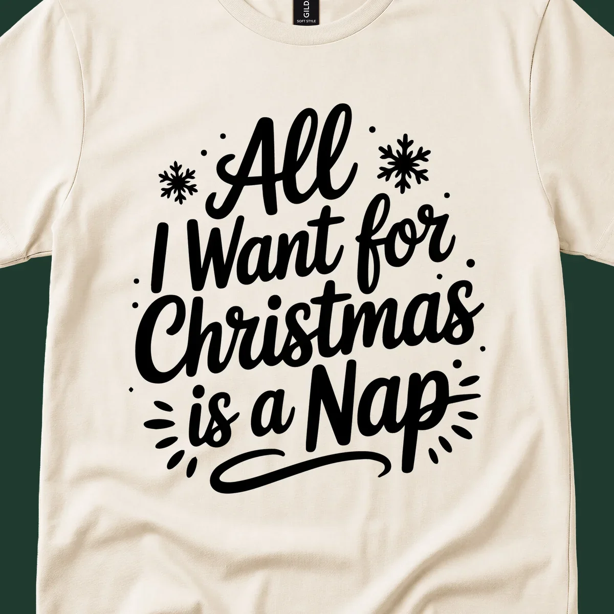 All I Want for Christmas Is A Nap typography design with snowflakes.