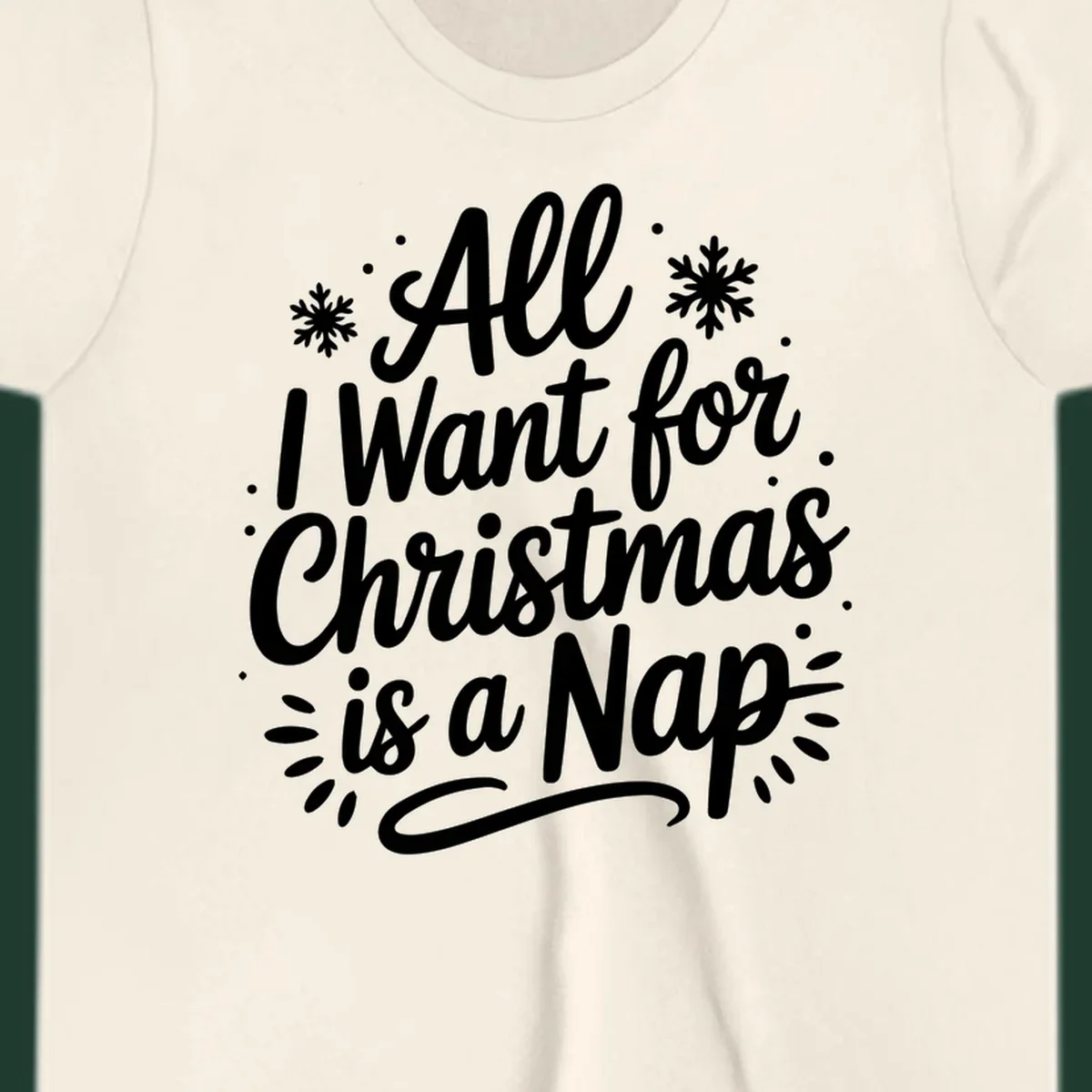 All I Want for Christmas Is A Nap typography design with snowflakes.