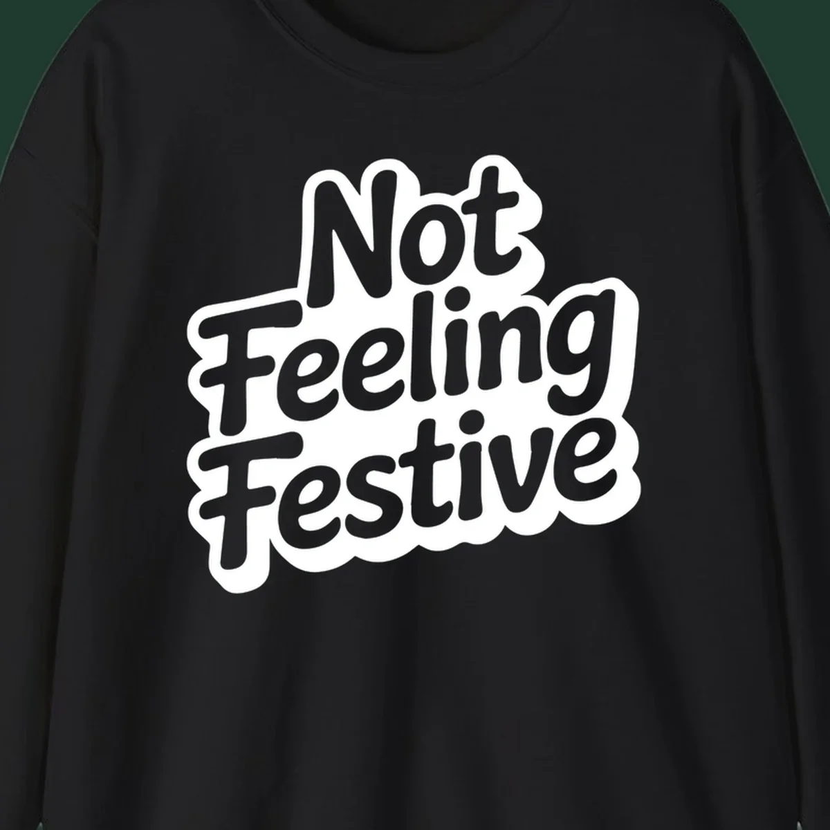Not Feeling Festive typography design with black text and white outline.