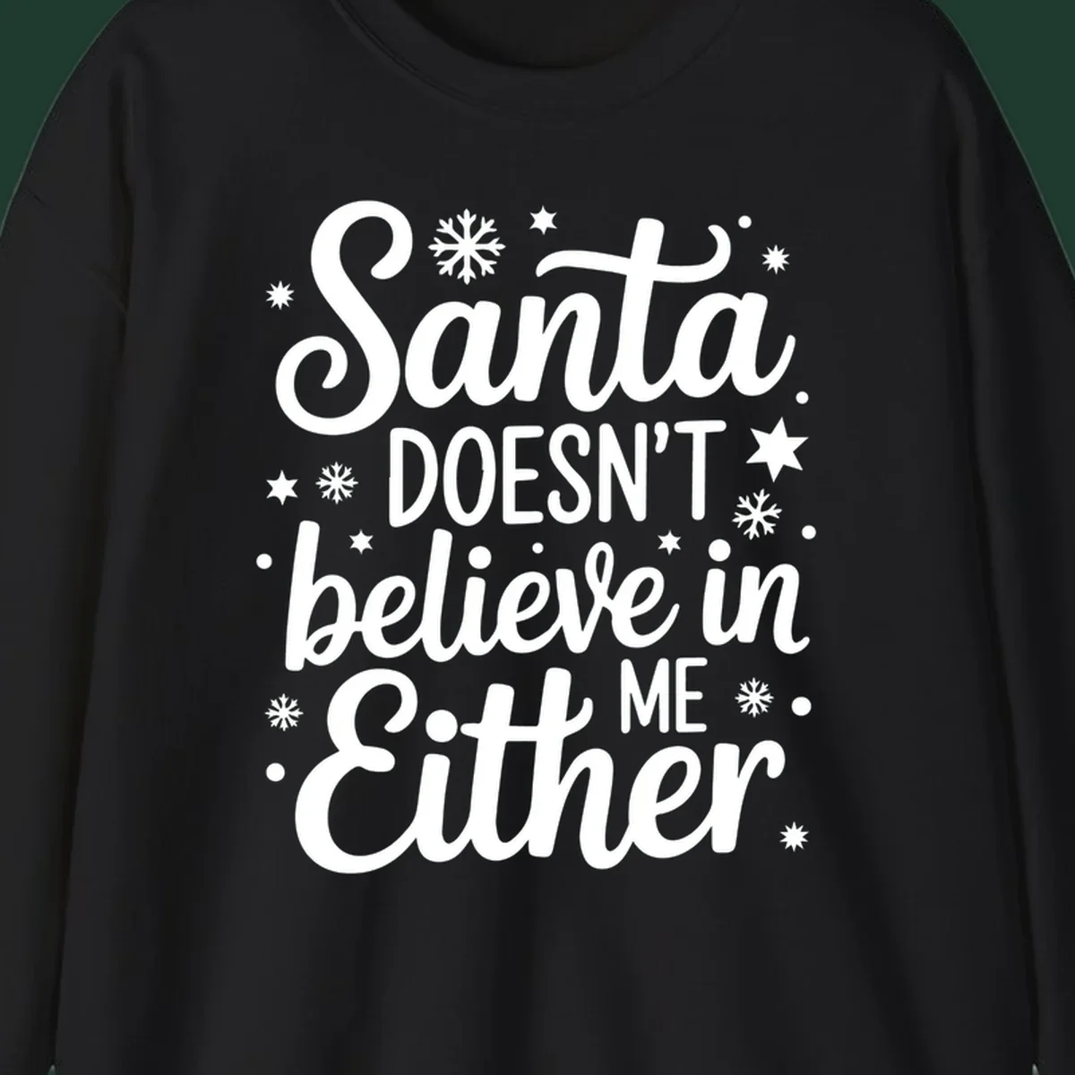 Typography design that reads Santa DOESN'T believe in ME Either, with snowflakes and stars.