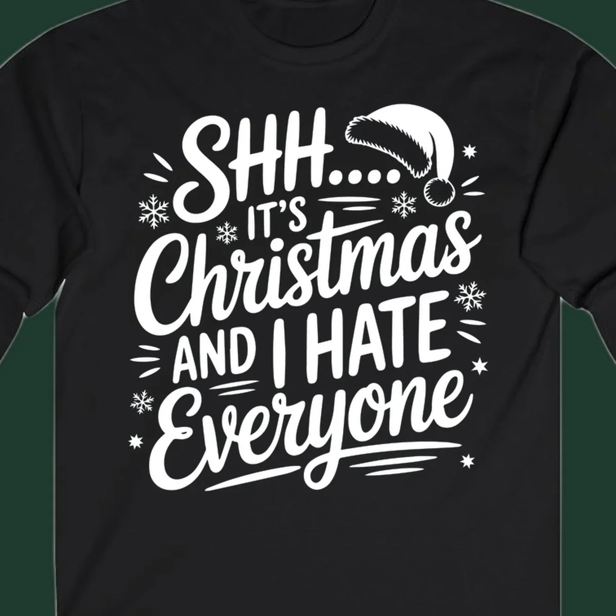 Shh it's Christmas And I Hate Everyone typography with Santa hat, snowflakes, and stars.