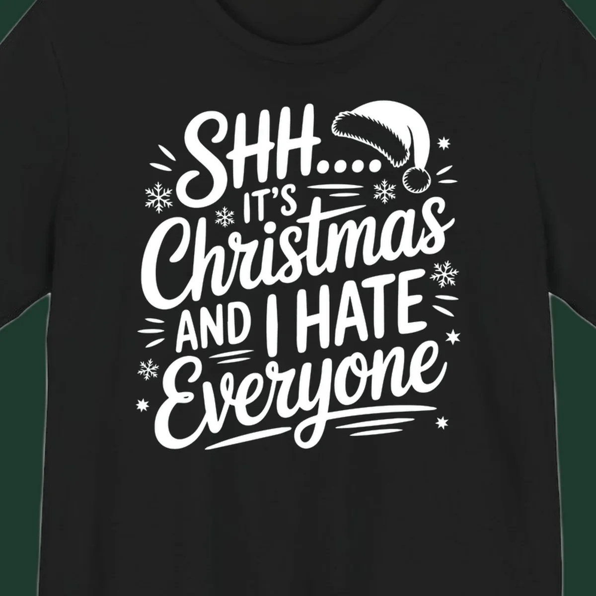Shh it's Christmas And I Hate Everyone typography with Santa hat, snowflakes, and stars.