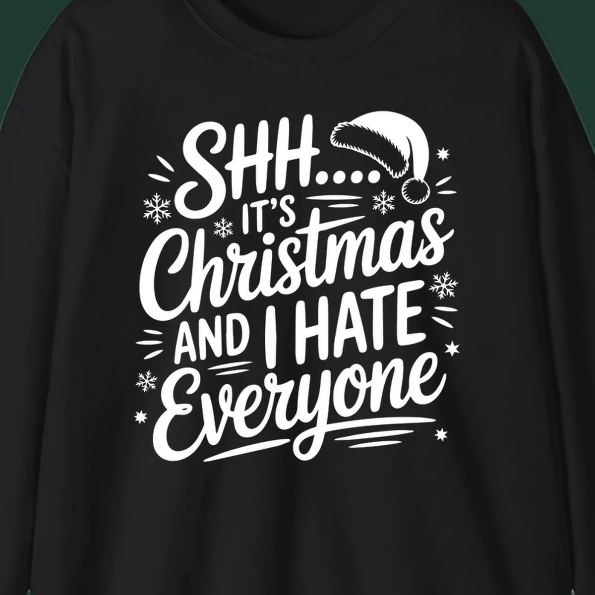 Shh it's Christmas And I Hate Everyone typography with Santa hat, snowflakes, and stars.