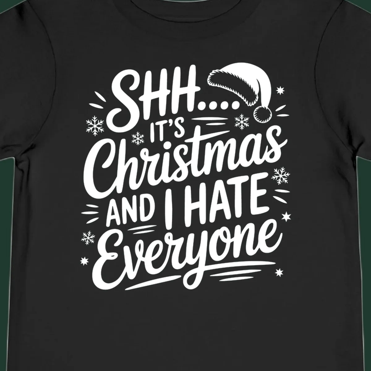Shh it's Christmas And I Hate Everyone typography with Santa hat, snowflakes, and stars.