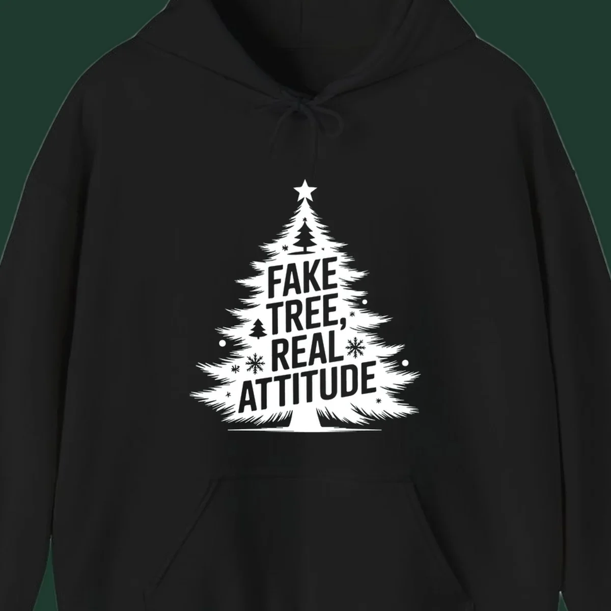 Christmas tree graphic with text 'FAKE TREE, REAL ATTITUDE' and snowflake accents.