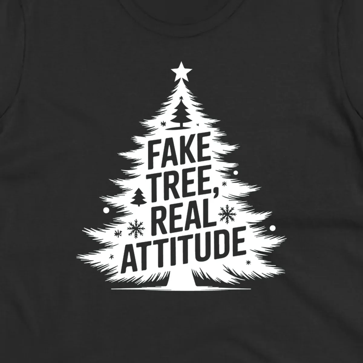 Christmas tree graphic with text 'FAKE TREE, REAL ATTITUDE' and snowflake accents.