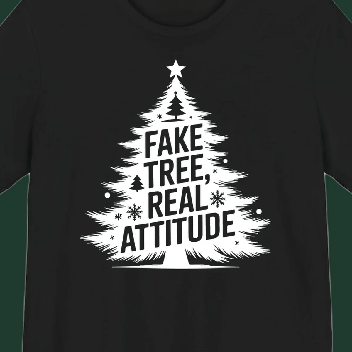 Christmas tree graphic with text 'FAKE TREE, REAL ATTITUDE' and snowflake accents.