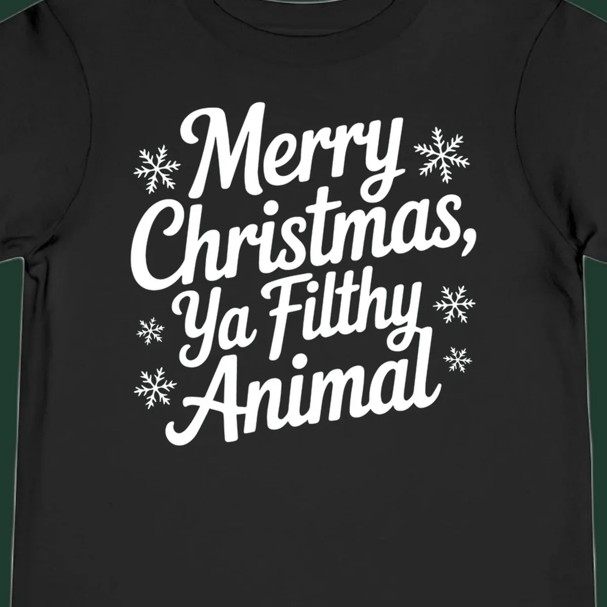 Merry Christmas Ya Filthy Animal typography with snowflakes.