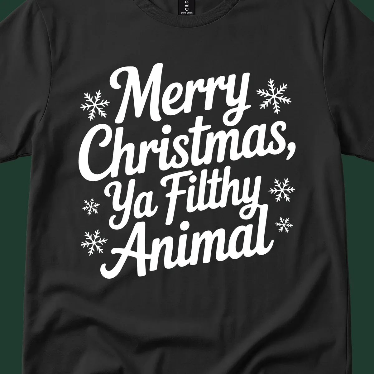 Merry Christmas Ya Filthy Animal typography with snowflakes.