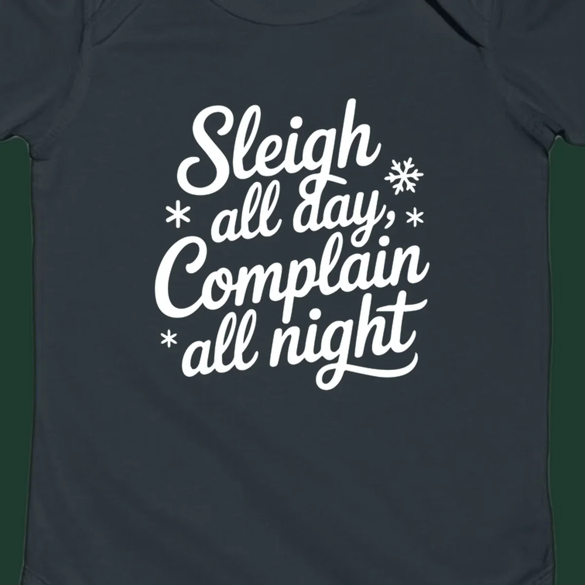 White typography reading 'Sleigh all day, Complain all night' with snowflakes and asterisks. sleigh-all-day.
