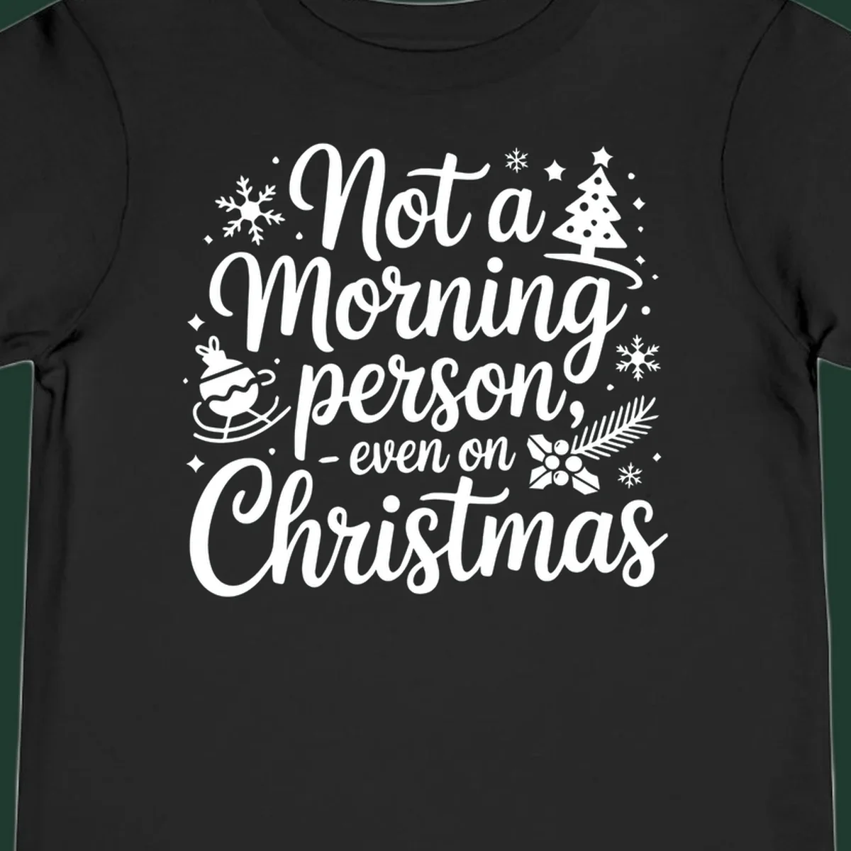 White typography on black background reads 'Not a Morning Person Christmas' with holiday graphics.