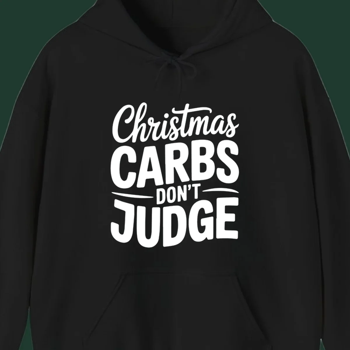 Christmas carbs don't judge phrase in white bold typography on black background.
