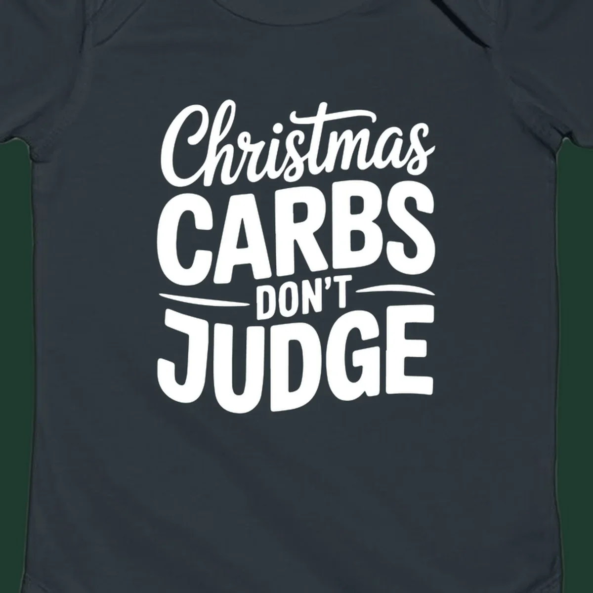 Christmas carbs don't judge phrase in white bold typography on black background.
