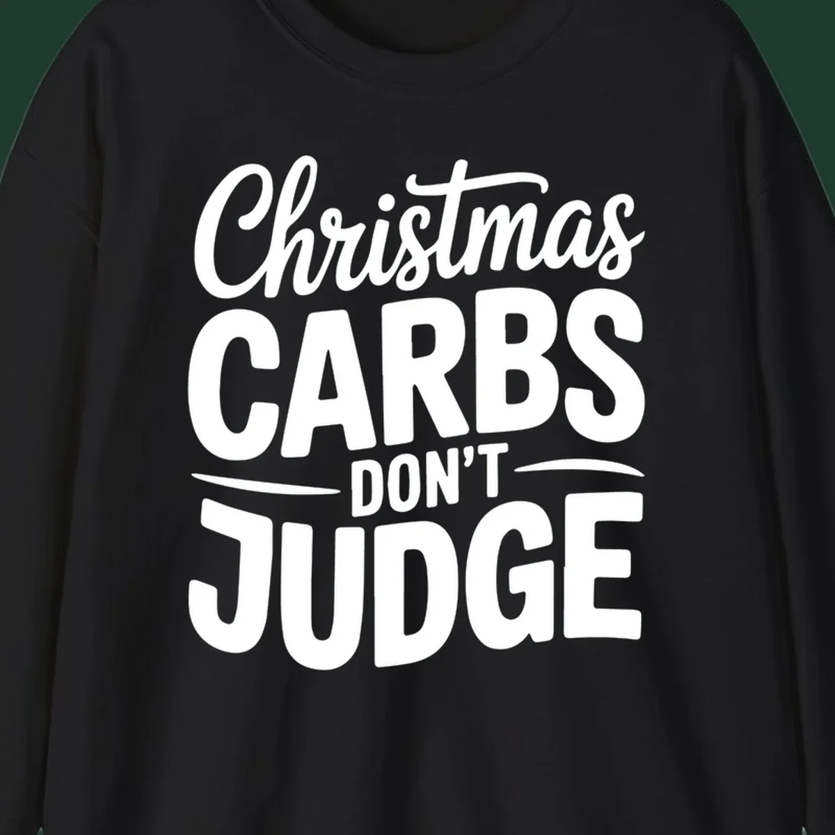 Christmas carbs don't judge phrase in white bold typography on black background.