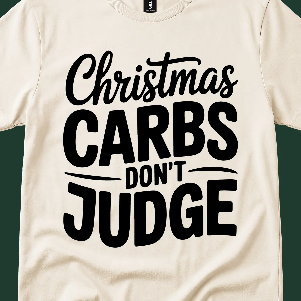 Christmas carbs don't judge phrase in white bold typography on black background.
