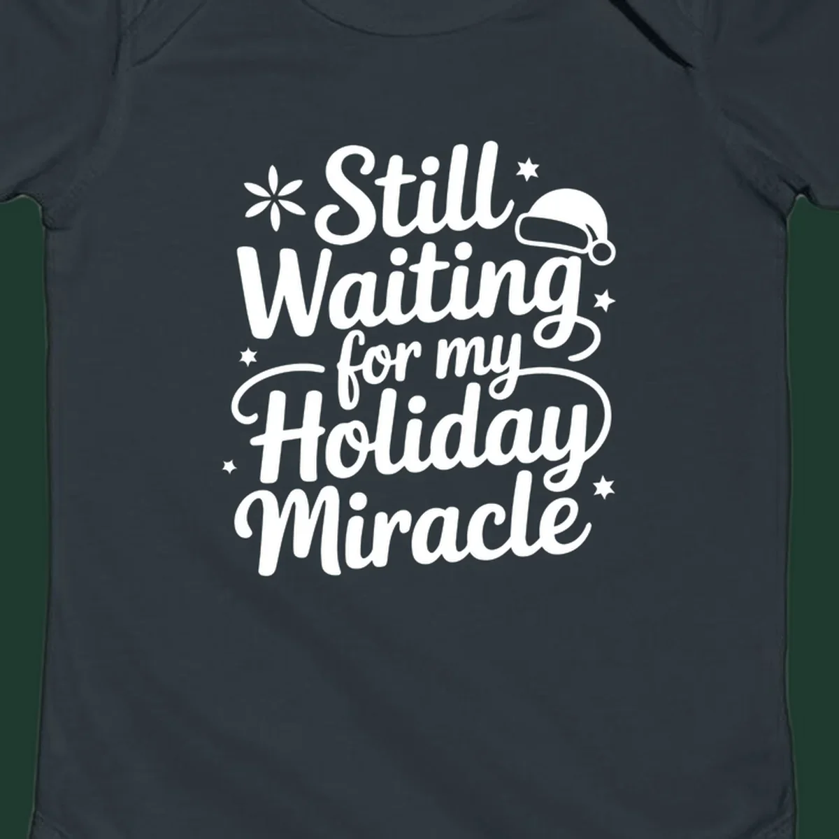 Text graphic 'Still Waiting for my Holiday Miracle' with holiday accents.