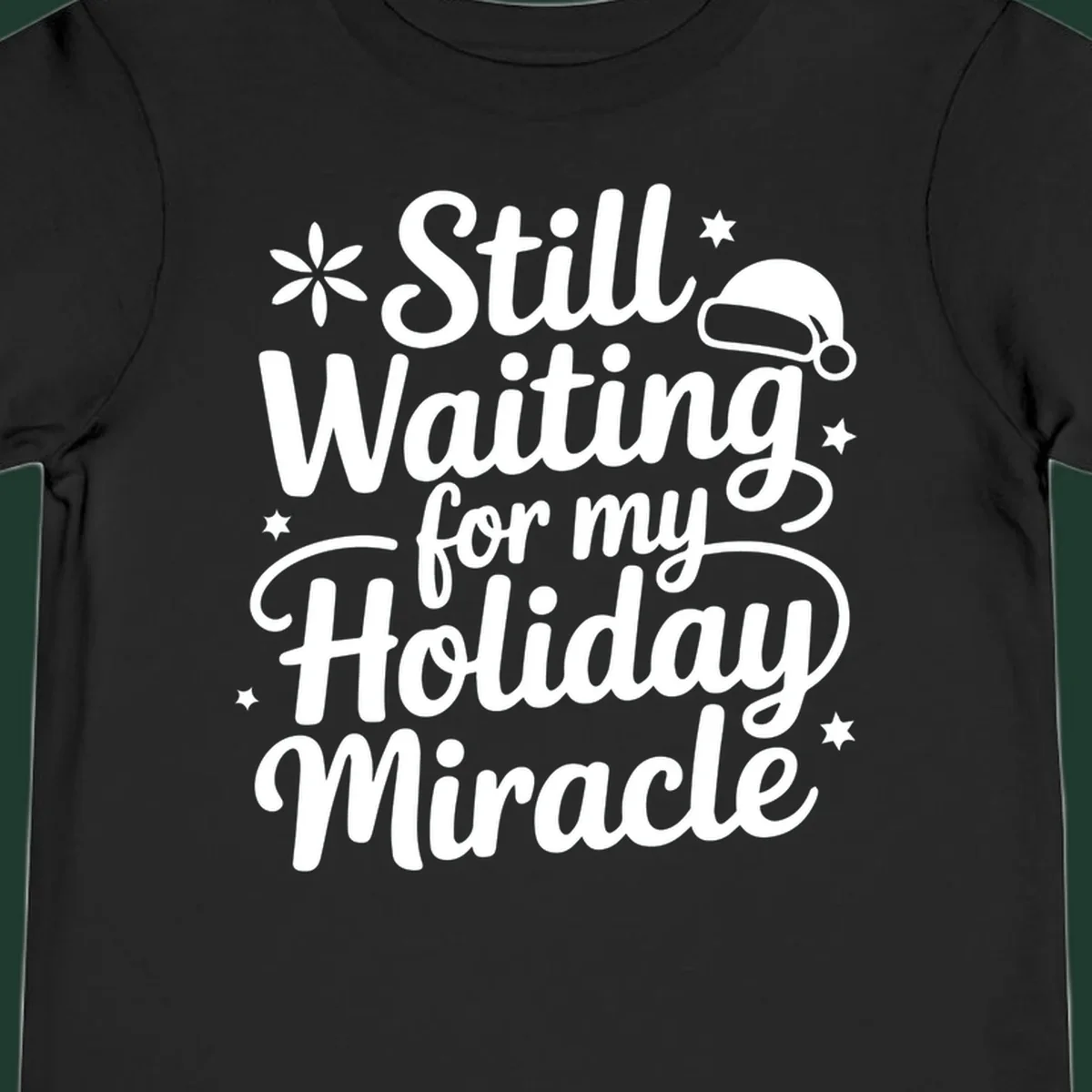 Text graphic 'Still Waiting for my Holiday Miracle' with holiday accents.