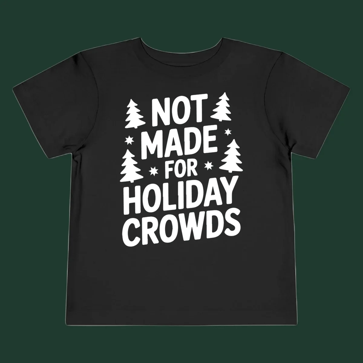Typography design with 'NOT MADE FOR HOLIDAY CROWDS' text, Christmas trees, and stars.